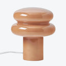 Ceramic table lamp with a unique design on a white background