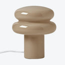 Beige table lamp with a unique design on a white background