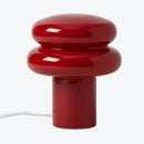 Red table lamp with a modern design on a white background