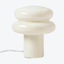 Modern table lamp with a white ceramic design on a white background