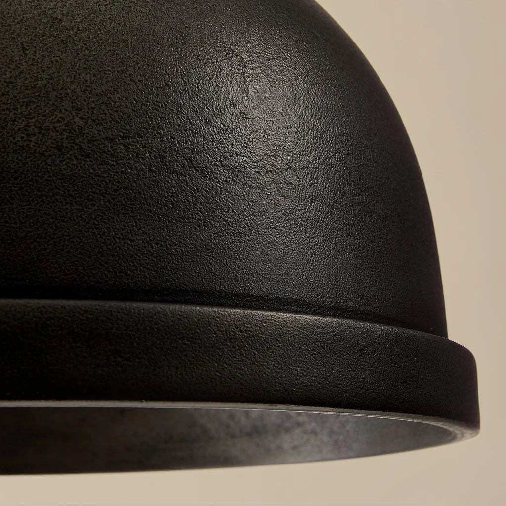 Close-up of a black textured object on a beige background