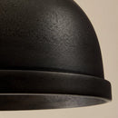 Close-up of a black textured object on a beige background