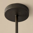 Ceiling light fixture with dark finish on a beige background