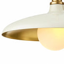 Close-up of a lamp with white and gold shade on a white background