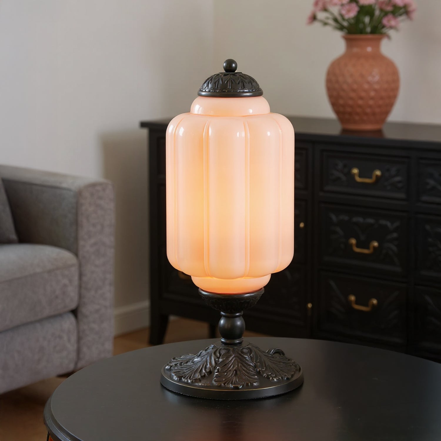 Decorative table lamp on a round table with a blurred background