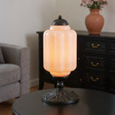 Decorative table lamp on a round table with a blurred background