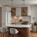Modern kitchen with wooden island, white countertops, and pendant lights.