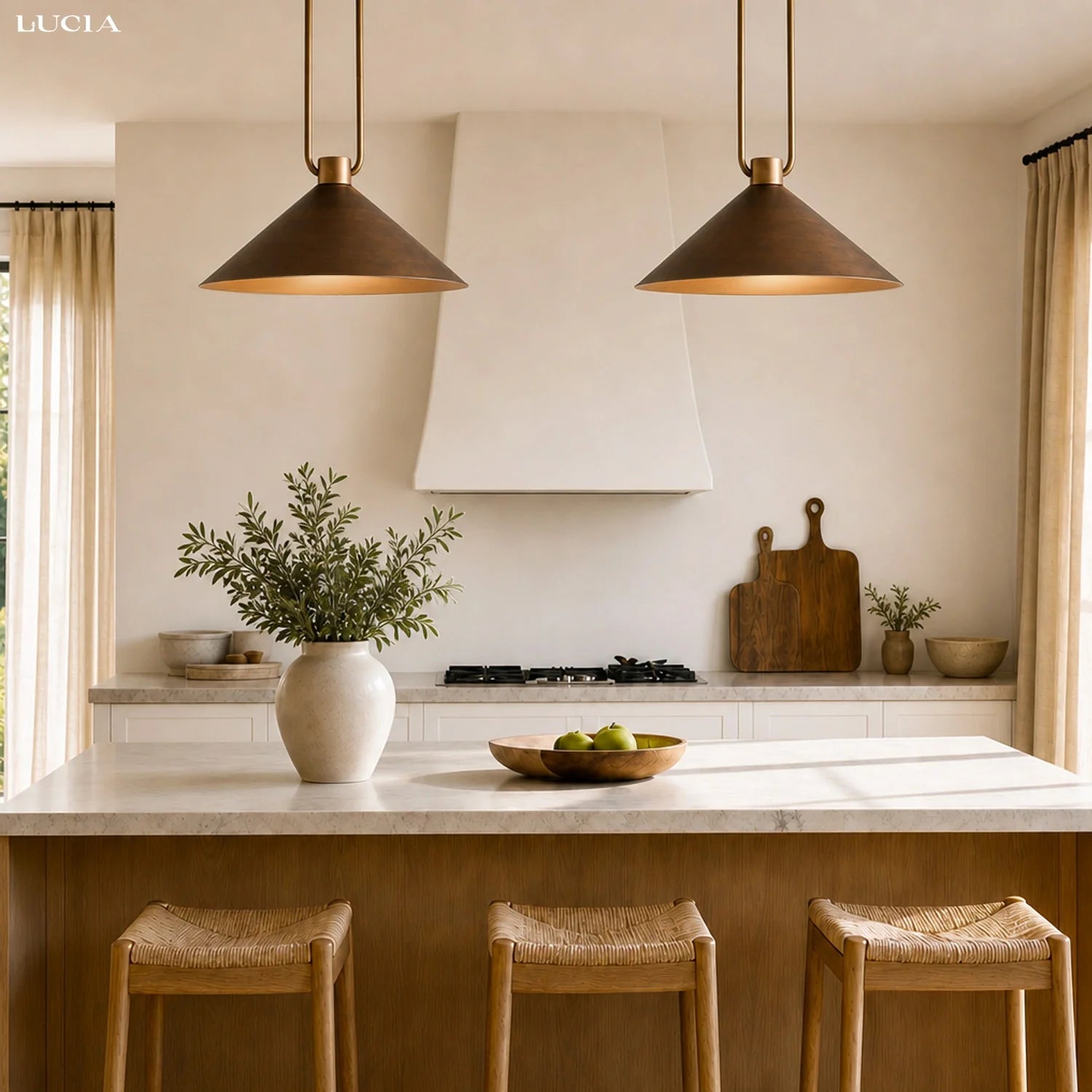 Modern kitchen with pendant lights, a vase with plants, and wooden stools.