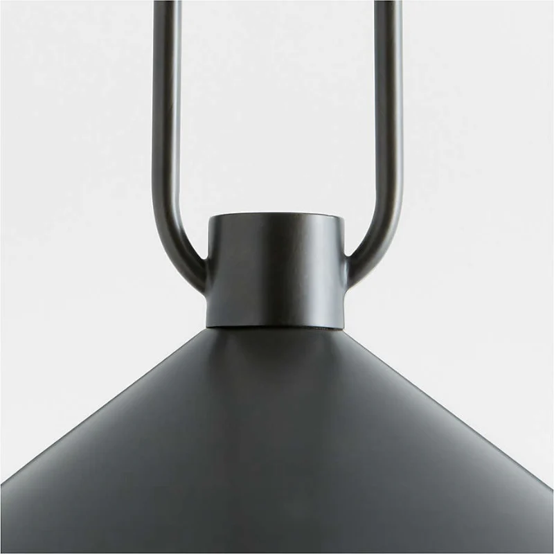 Black pendant light with a white background