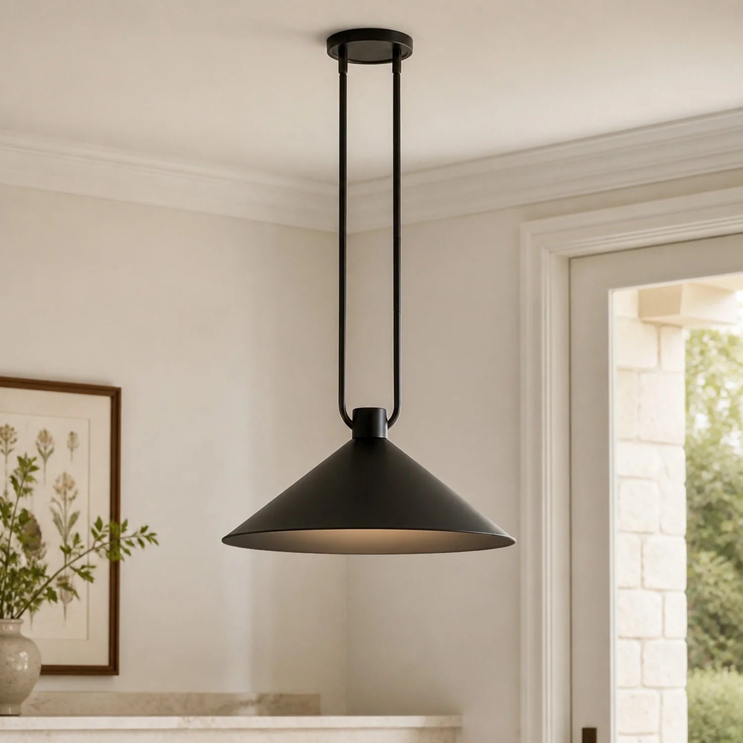 Black pendant light hanging in a room with a neutral color scheme.