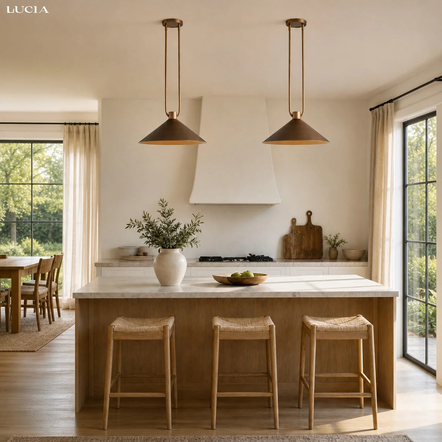 Modern kitchen with pendant lights, island, and stools.