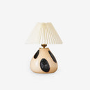 Decorative table lamp with a unique design on a white background