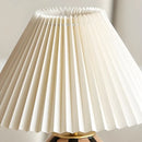 White pleated lampshade on a neutral background