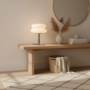 Wooden console table with decorative items in a room setting