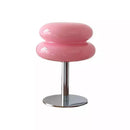 Pink stool with a chrome base on a white background