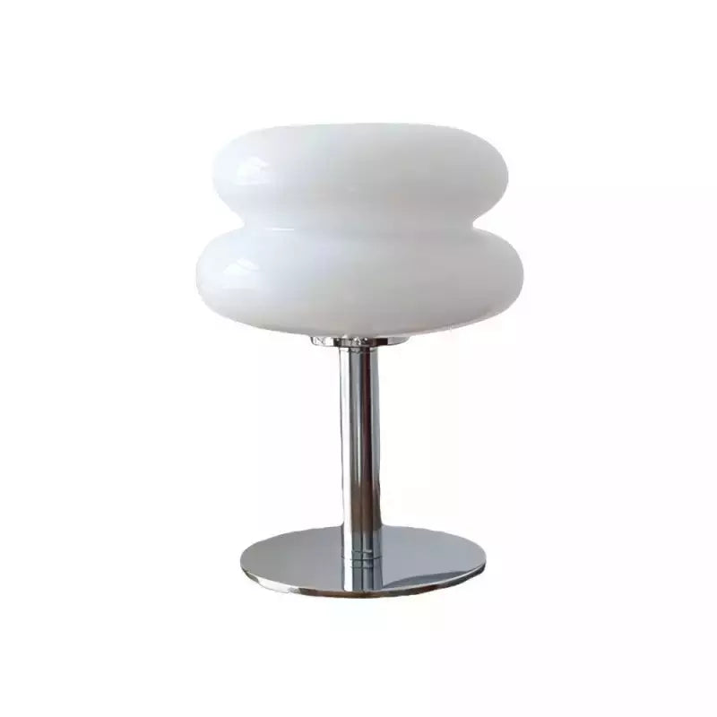 Modern table lamp with white glass shade and chrome base on a white background
