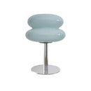 Modern stool with a light blue, bubble-like top and metallic base on a white background