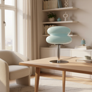 Modern living room with a light blue table lamp on a wooden coffee table.