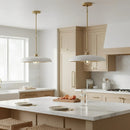 Modern kitchen with marble island, pendant lights, and neutral tones.
