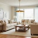Living room with beige sofas, wooden coffee table, and pendant light.