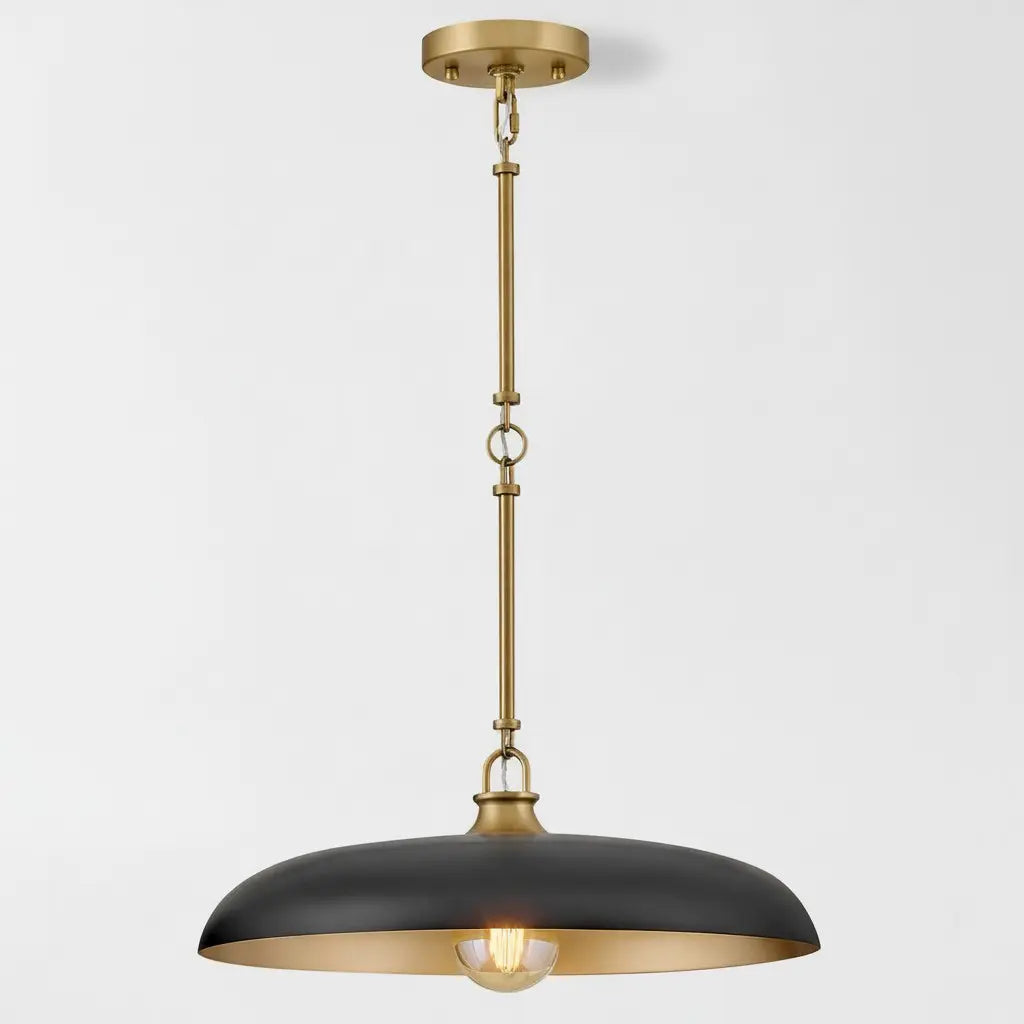 Pendant light with black shade and gold fixture on a white background