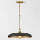 Pendant light with black shade and gold fixture on a white background