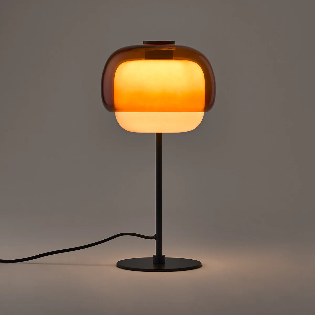 Table lamp with a warm glow on a dark background