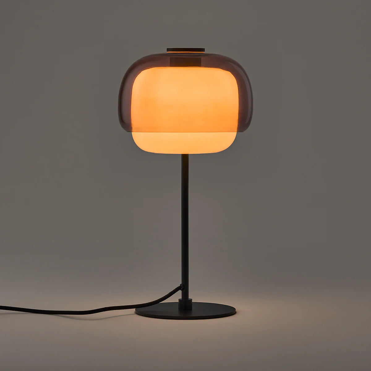 Table lamp with a warm glow on a dark background
