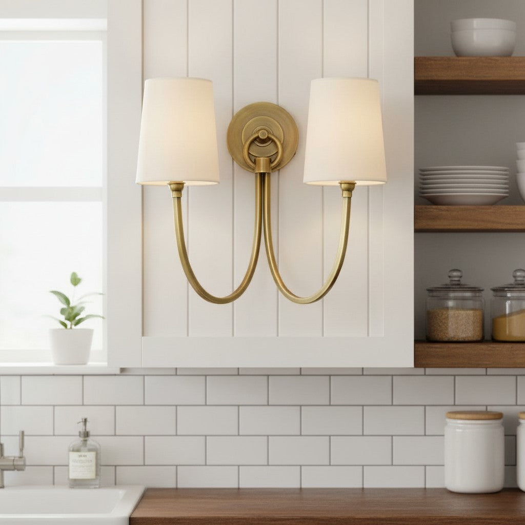 Double wall sconce with white lampshades in a kitchen setting