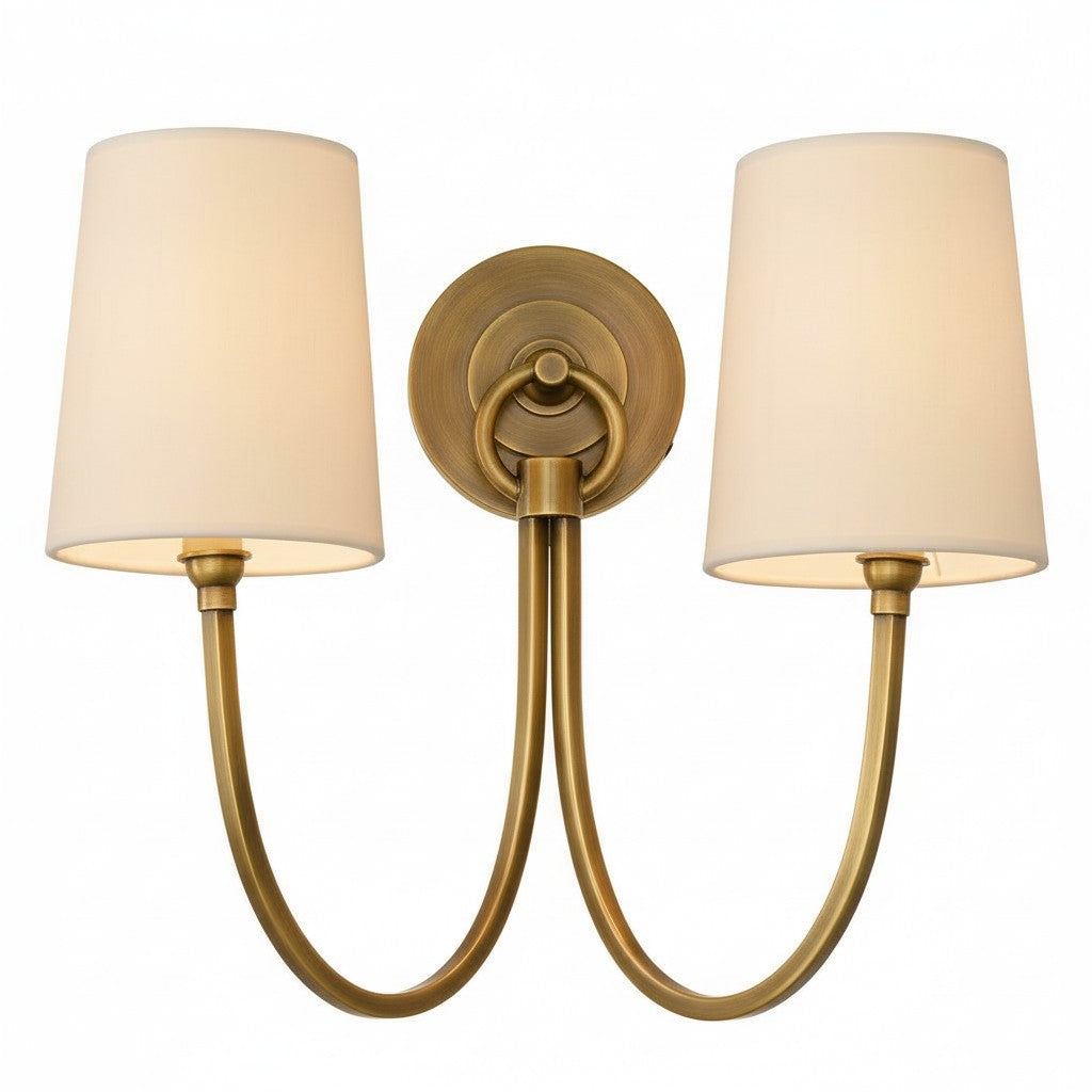 Double wall sconce with gold finish and beige lampshades on a white background