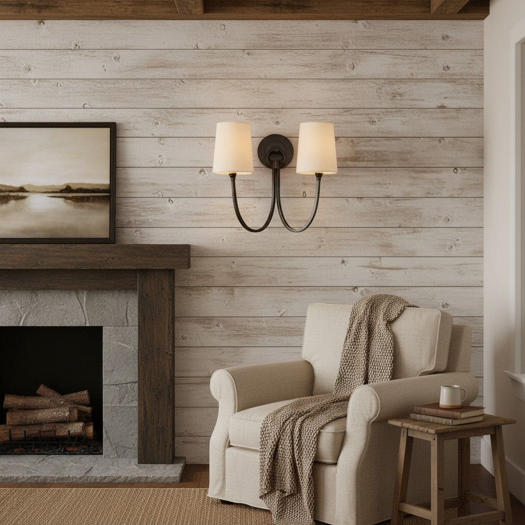 Cozy living room with a fireplace, armchair, and wall sconce.