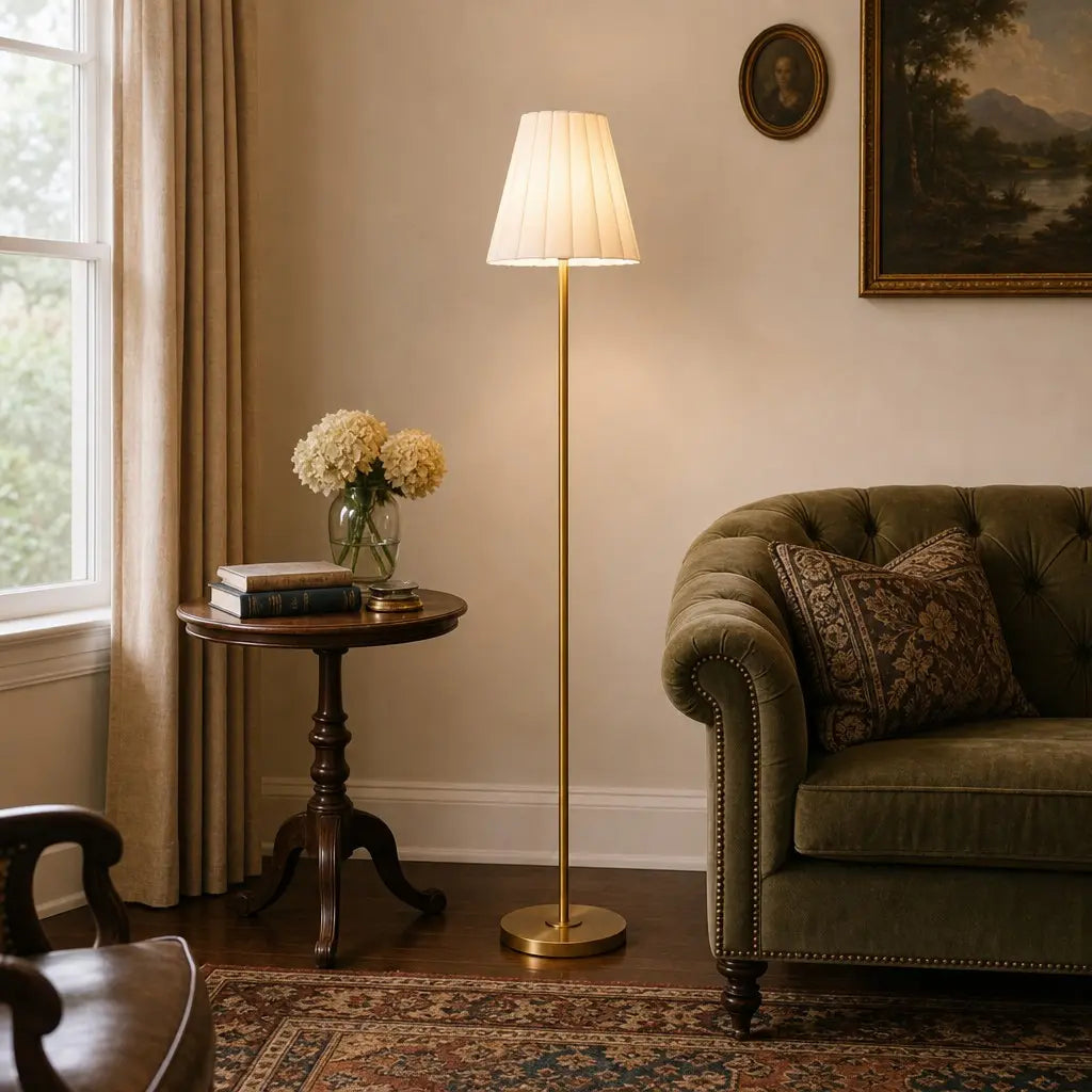 Living room with a lamp, side table, and sofa.