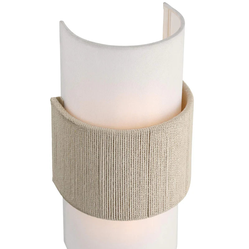 Candle holder with a textured beige base and white candle on a white background