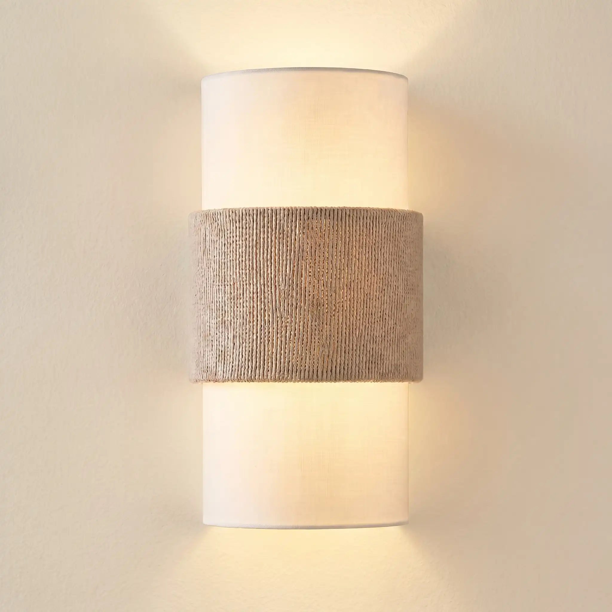 Wall-mounted lamp with textured brown band and white shade on a neutral background