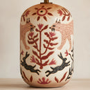 Ceramic lamp with animal and floral patterns on a neutral background