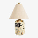 Decorative table lamp with butterfly design on a white background