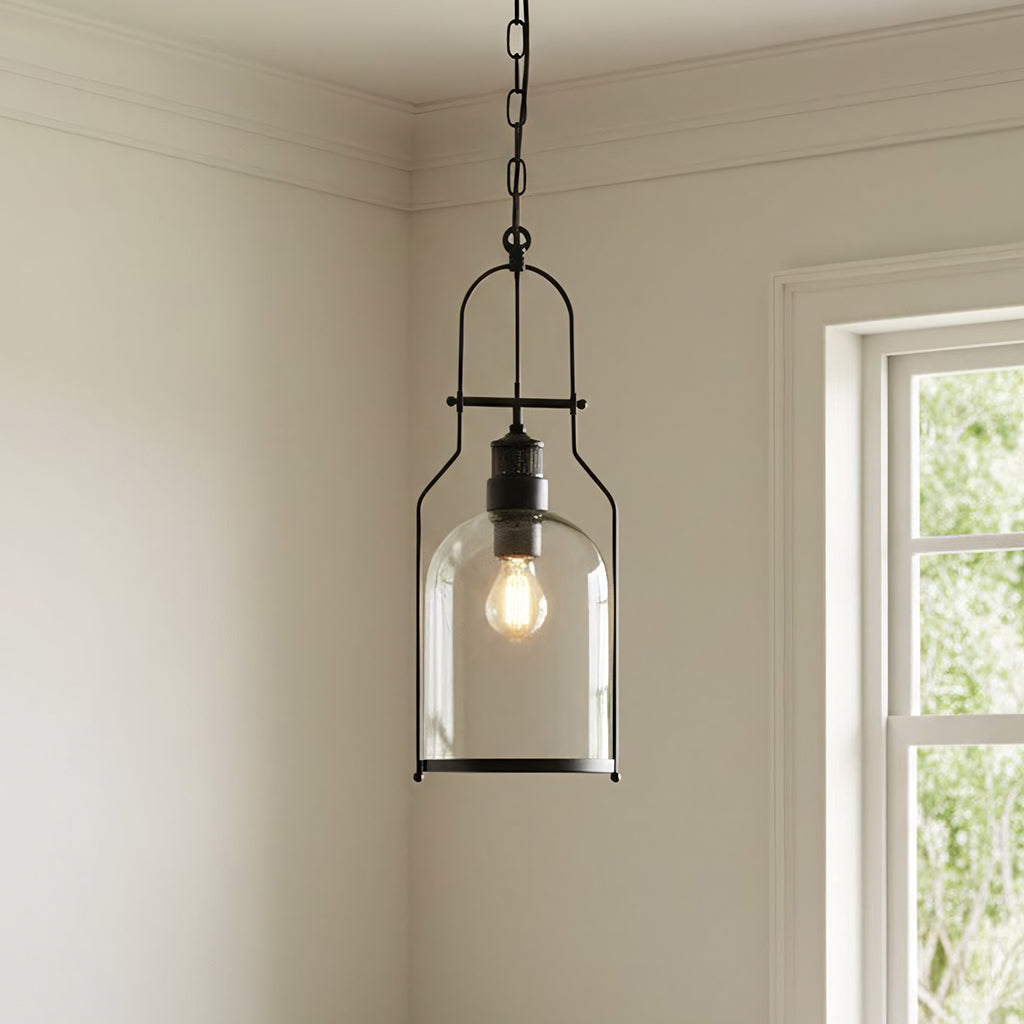 Pendant light fixture hanging in a room with a window in the background