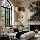 Luxurious living room with white sofa, fireplace, and large windows.