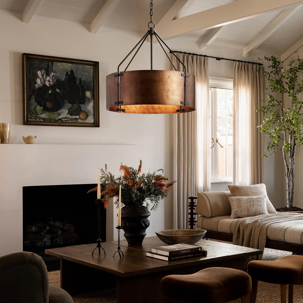 Cozy living room with a fireplace, wooden coffee table, and decorative elements.