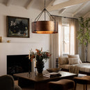 Cozy living room with a fireplace, wooden coffee table, and decorative elements.