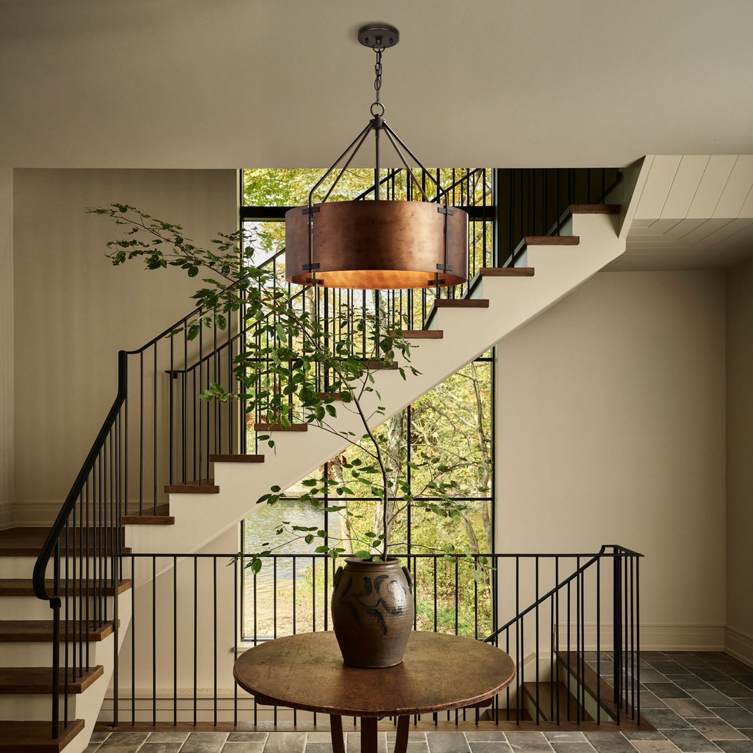 Staircase with a wooden table and decorative vase in a home interior.