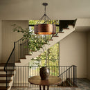 Staircase with a wooden table and decorative vase in a home interior.