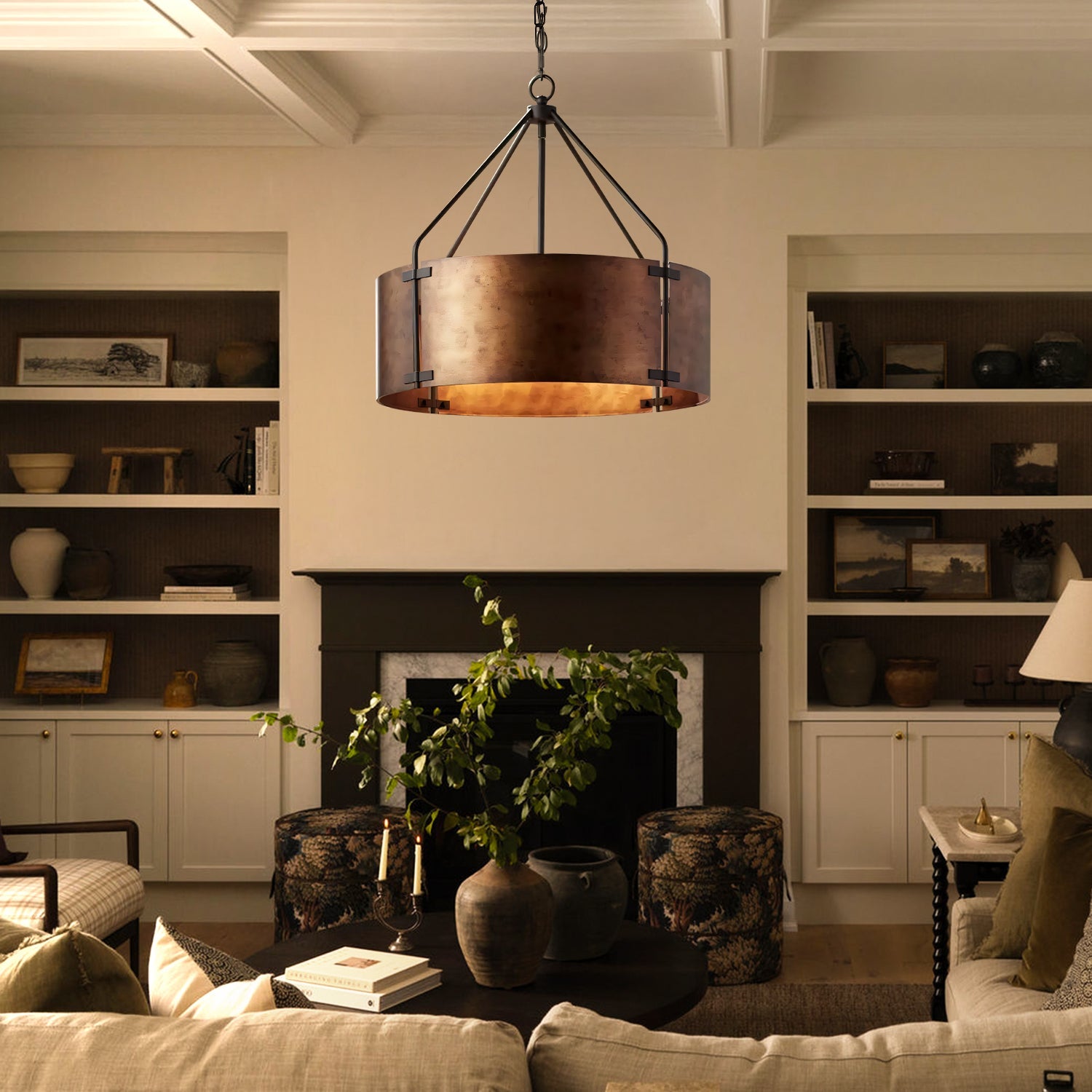 Living room with a chandelier, bookshelf, and fireplace.