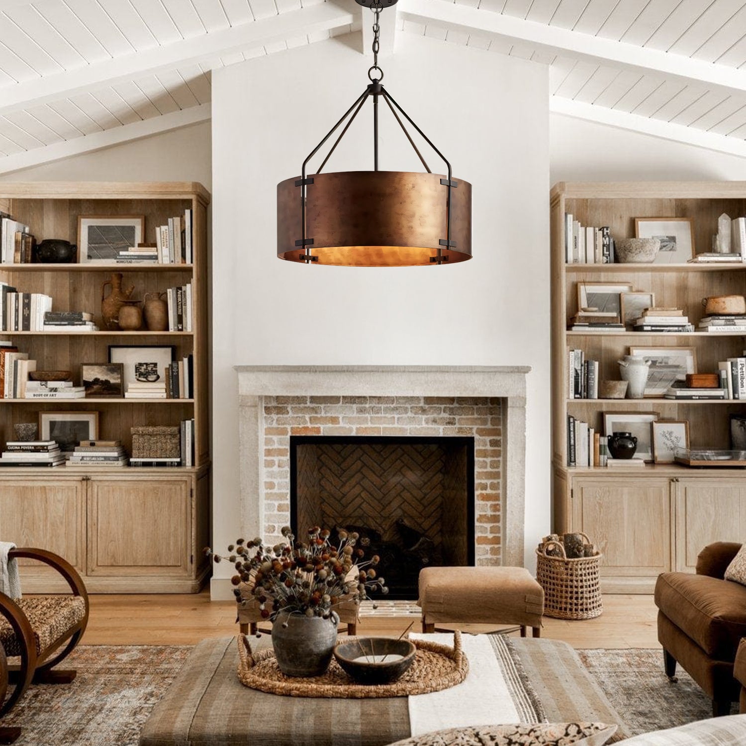Living room with wooden bookshelves, a fireplace, and decorative items.