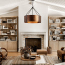 Living room with wooden bookshelves, a fireplace, and decorative items.