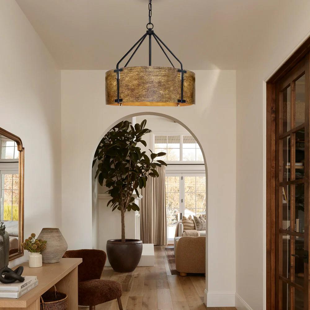 Living room with a pendant light, plant, and furniture.