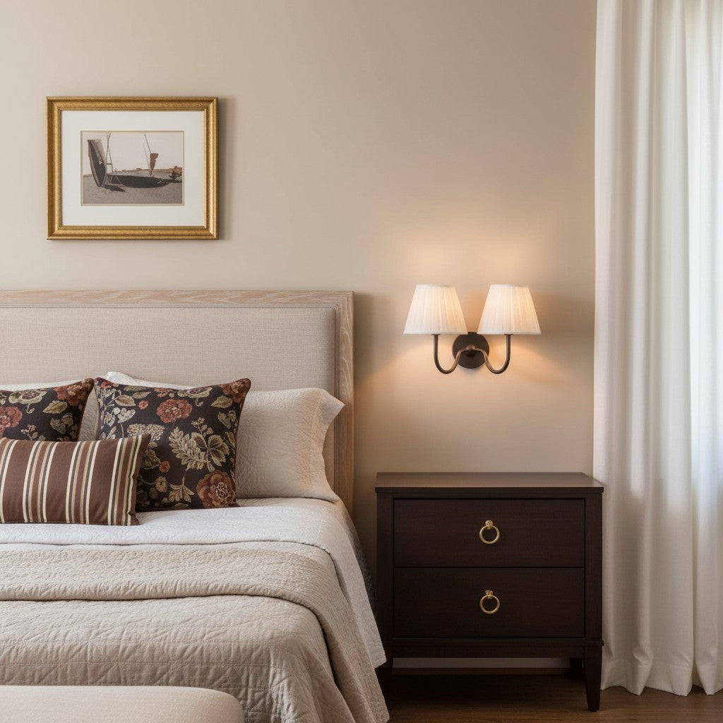 Neatly made bed with decorative pillows in a bedroom setting.