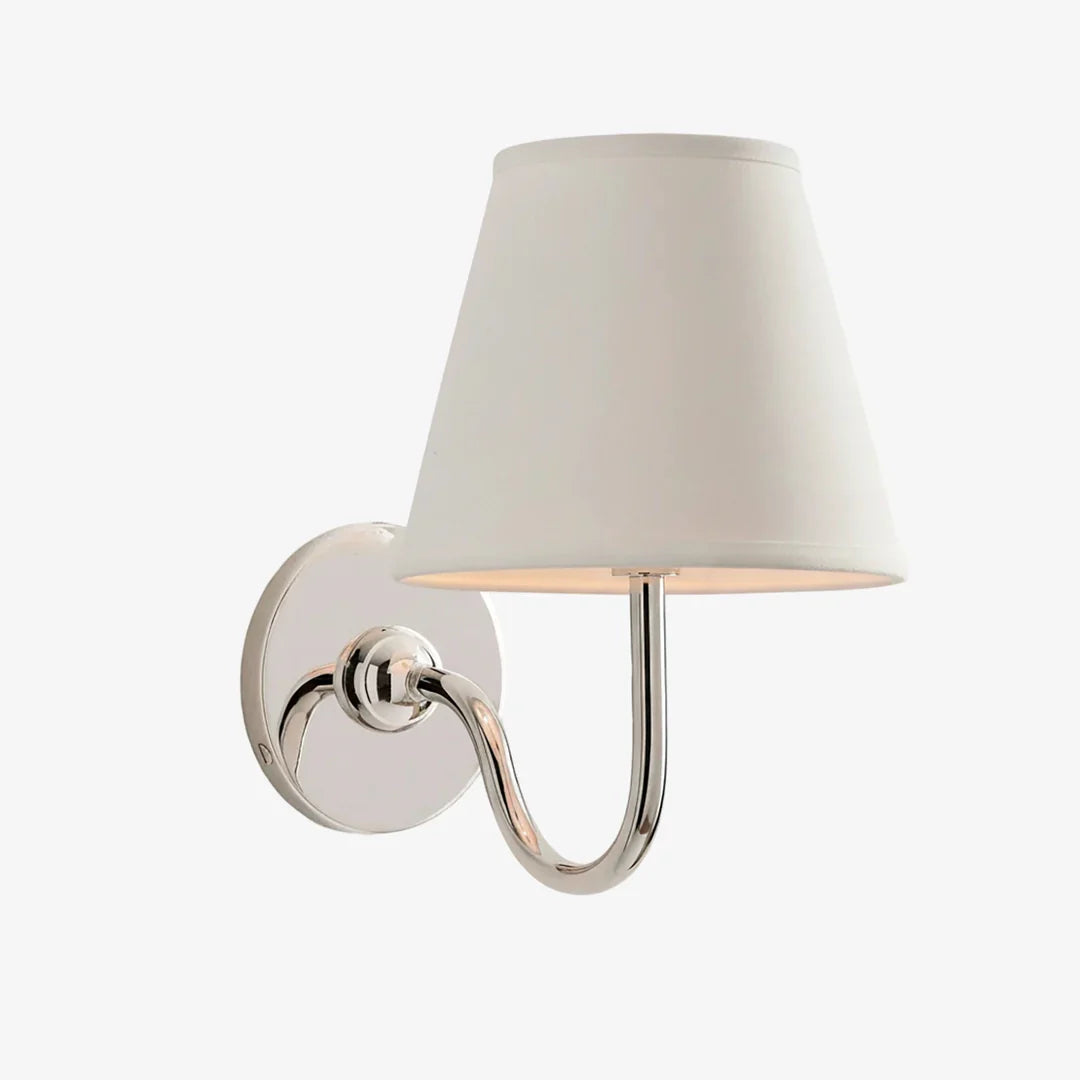 Wall-mounted lamp with a white shade on a white background