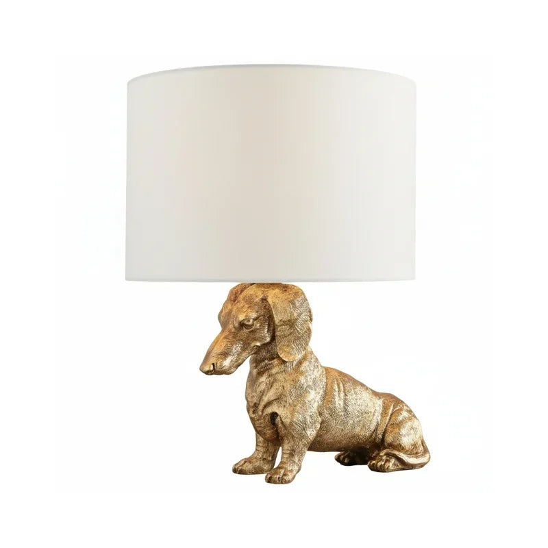 Decorative lamp with a dog-shaped base on a white background