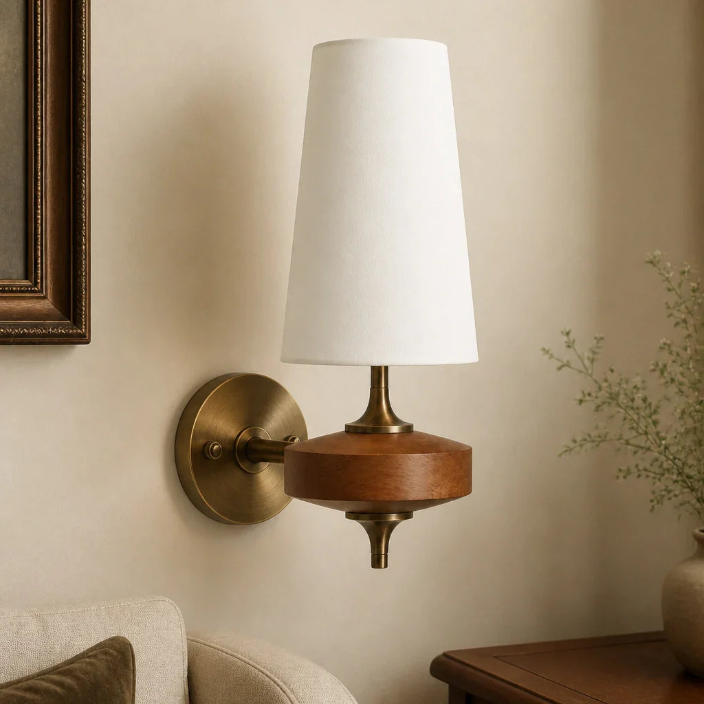 Wall-mounted lamp with wooden base and white shade on a beige wall.